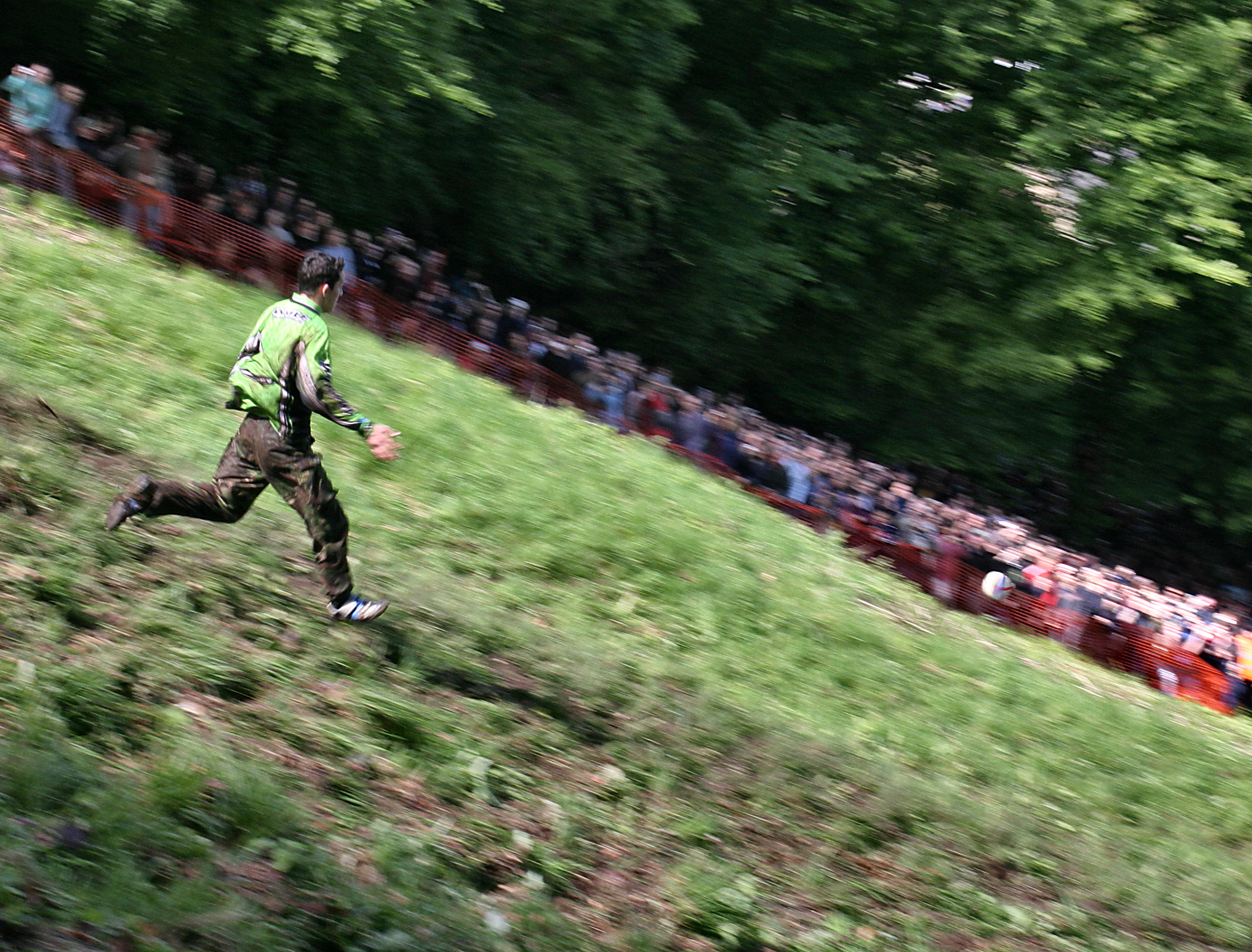 Chris Anderson leading a men's downhill cheese rolling race at Cooper's Hill.